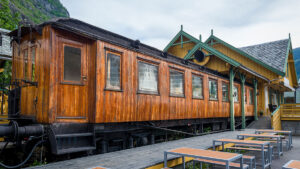 Retro train in Flam, Norway. Retro wooden railway carriage at station of Flamsbana - famous old mountain railway in Flam, Norway.