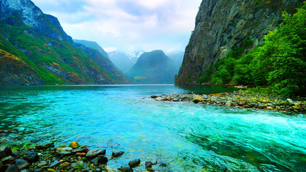 Fjord and river, Norway. Scenic view of Sognefjord, Norway. A river flowing in a fjord.