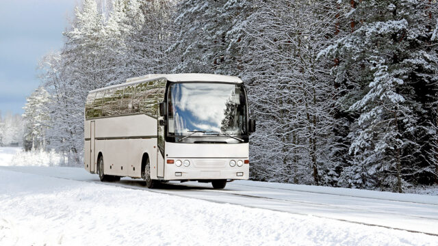 Coach in snowy ski resort