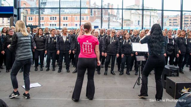 Choir performing at Leeds Station