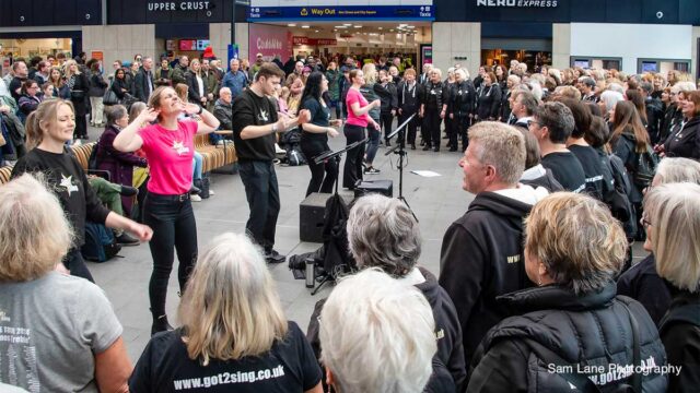 Choir performing at Leeds Station