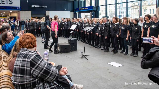 Choir performing at Leeds Station