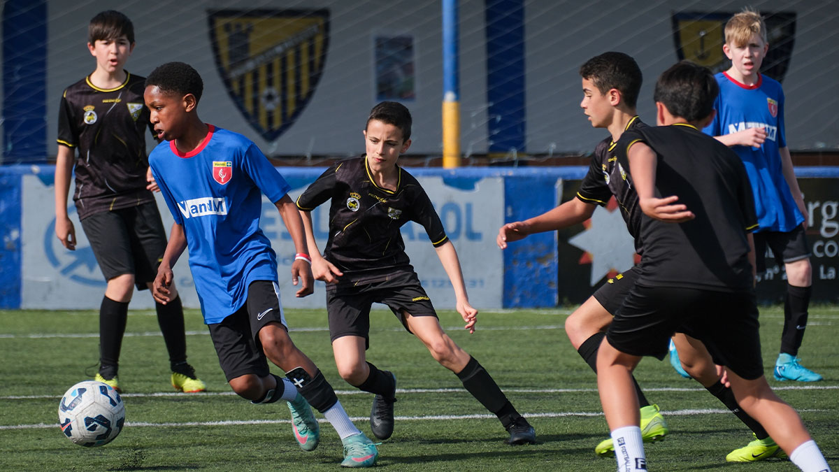 Young boy playing football on a school tour to Gibraltar 