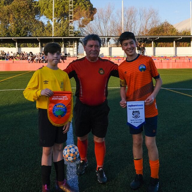 Two youth football teams after a tournament game