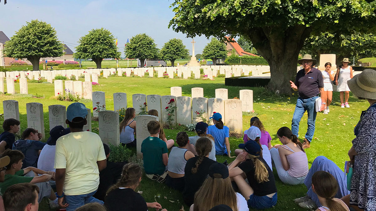 Radnor House listening to a history tour guide on their battlefields trip to Belgium